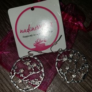 Silver colored nadine west earrings